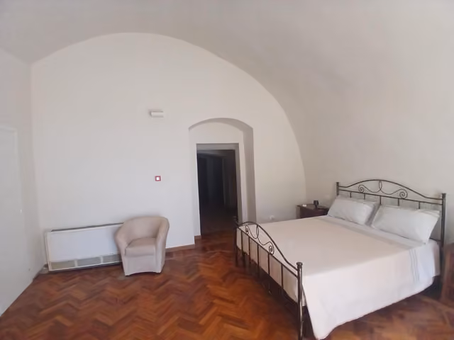 Camera matrimoniale di Tursi Relais Virtus con letto rifatto